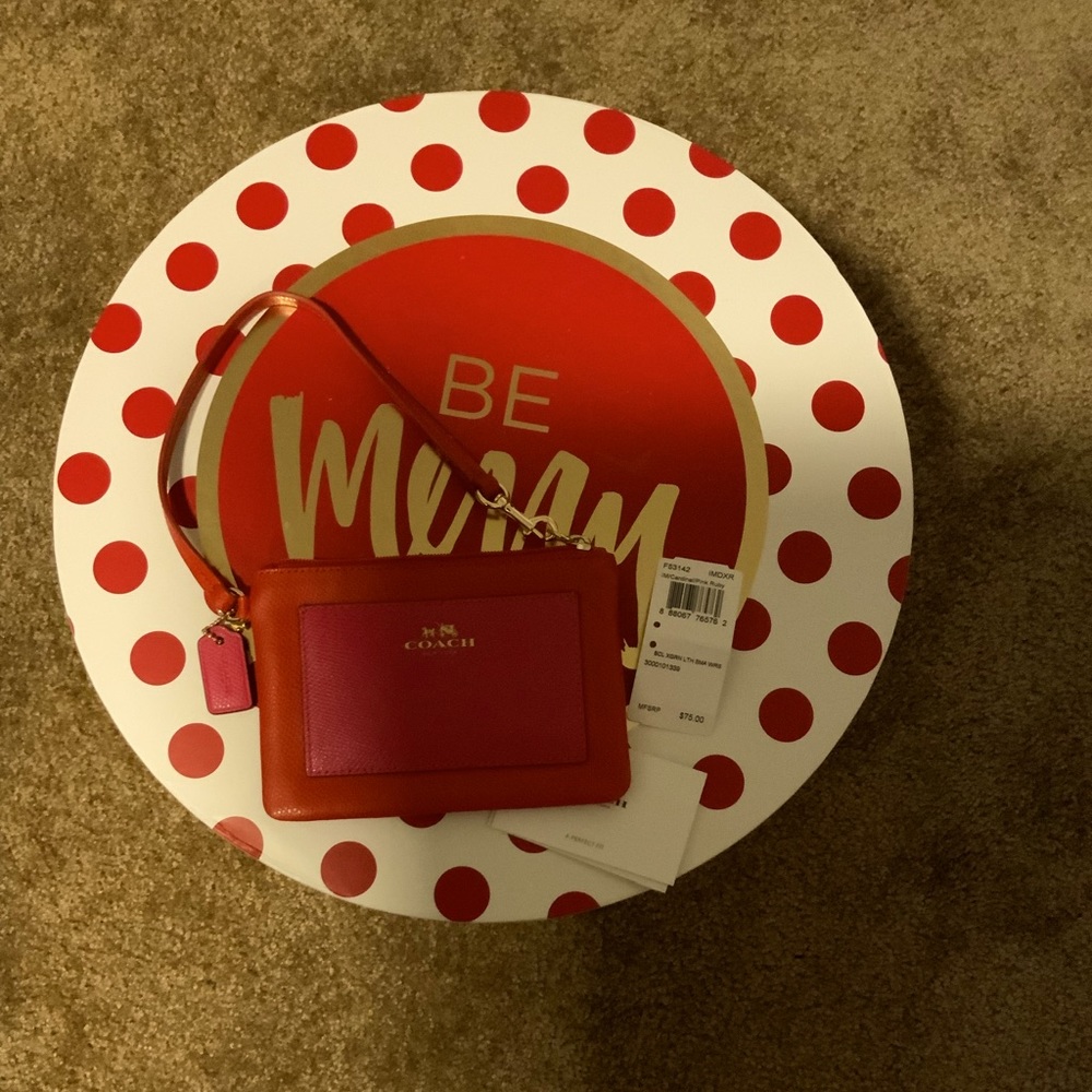 Almost New Adorable Coach Wristlet.